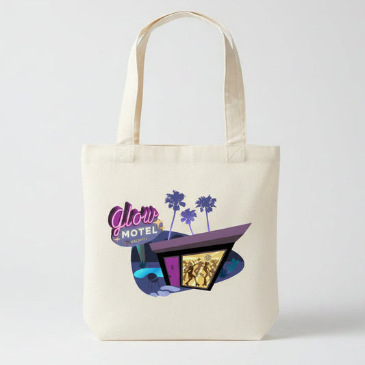 An off-white canvas tote bag featuring a colorful graphic print of a retro 'Glow Motel' with purple palm trees and a stylized building.