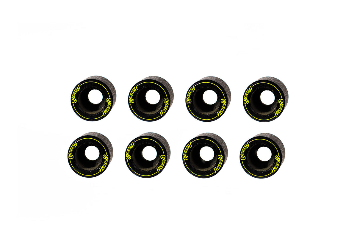 Eight black skateboard wheels with bright yellow 'Vexix' branding, arranged in two rows of four on a solid white background.