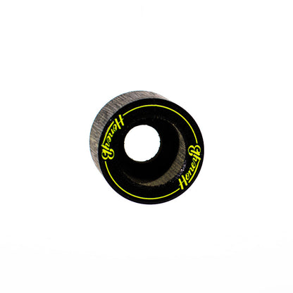 A single skateboard wheel with a black outer ring, textured gray inner barrel, and bright yellow 'Herbert' branding printed on the side, set against a plain white background.