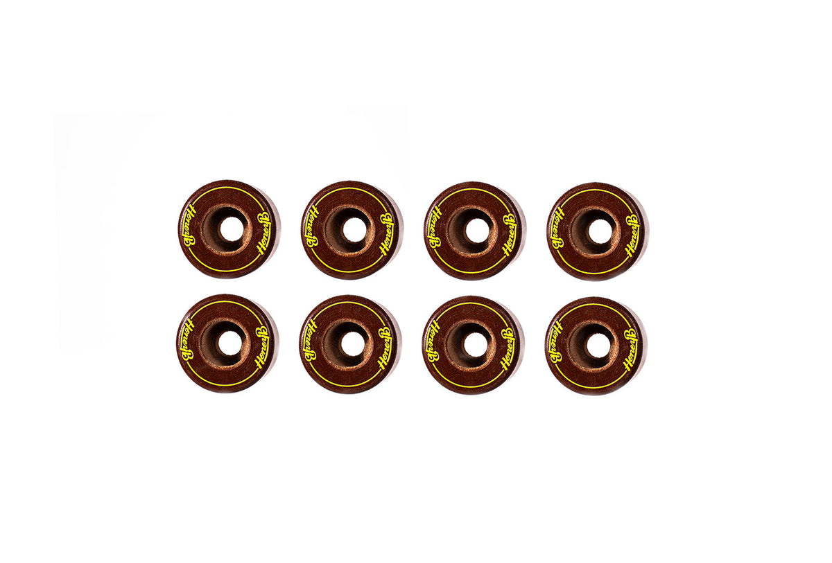 Eight skateboard wheels arranged in two rows of four on a plain white background. The wheels are dark brown with bright yellow branding text that reads 'SOL LEATHER'.
