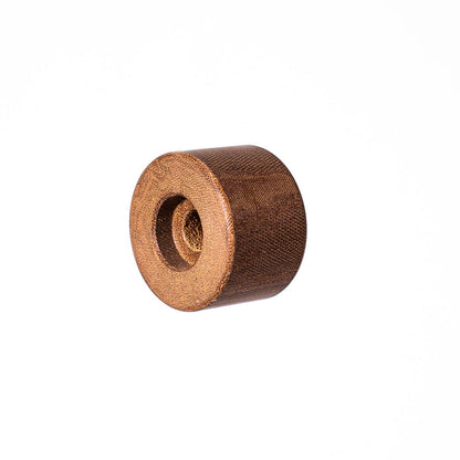 A small cylindrical wooden dowel or knob with a hollow center hole, finished in a warm medium brown wood tone, shown on a plain white background.