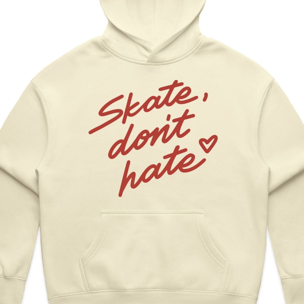 An off-white hooded sweatshirt with the phrase 'Skate, don't hate' printed in red cursive text across the chest, accompanied by a small red heart.
