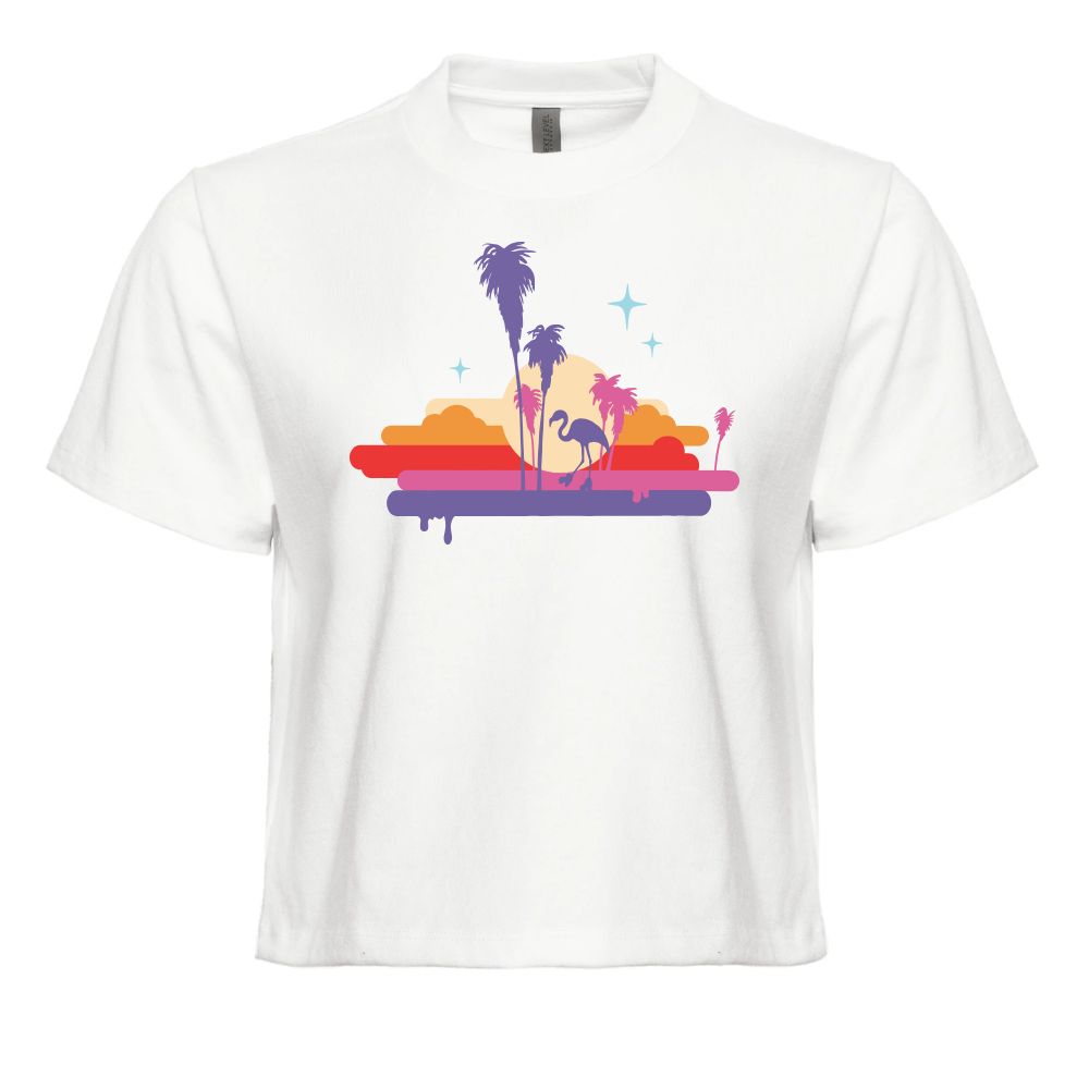 A white short-sleeve crewneck t-shirt featuring a colorful retro graphic of palm trees, a flamingo, and a sunset on a surfboard, displayed against a solid white background.